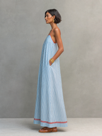 Women's striped maxi dress with spaghetti straps and red trim detail