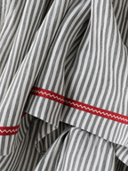 Women's striped maxi dress with spaghetti straps and red trim detail