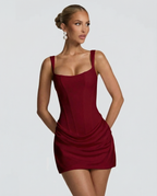 Women's mini dress with square neckline, draped skirt and lace-up back