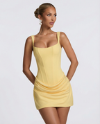 Women's mini dress with square neckline, draped skirt and lace-up back