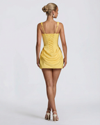 Women's mini dress with square neckline, draped skirt and lace-up back