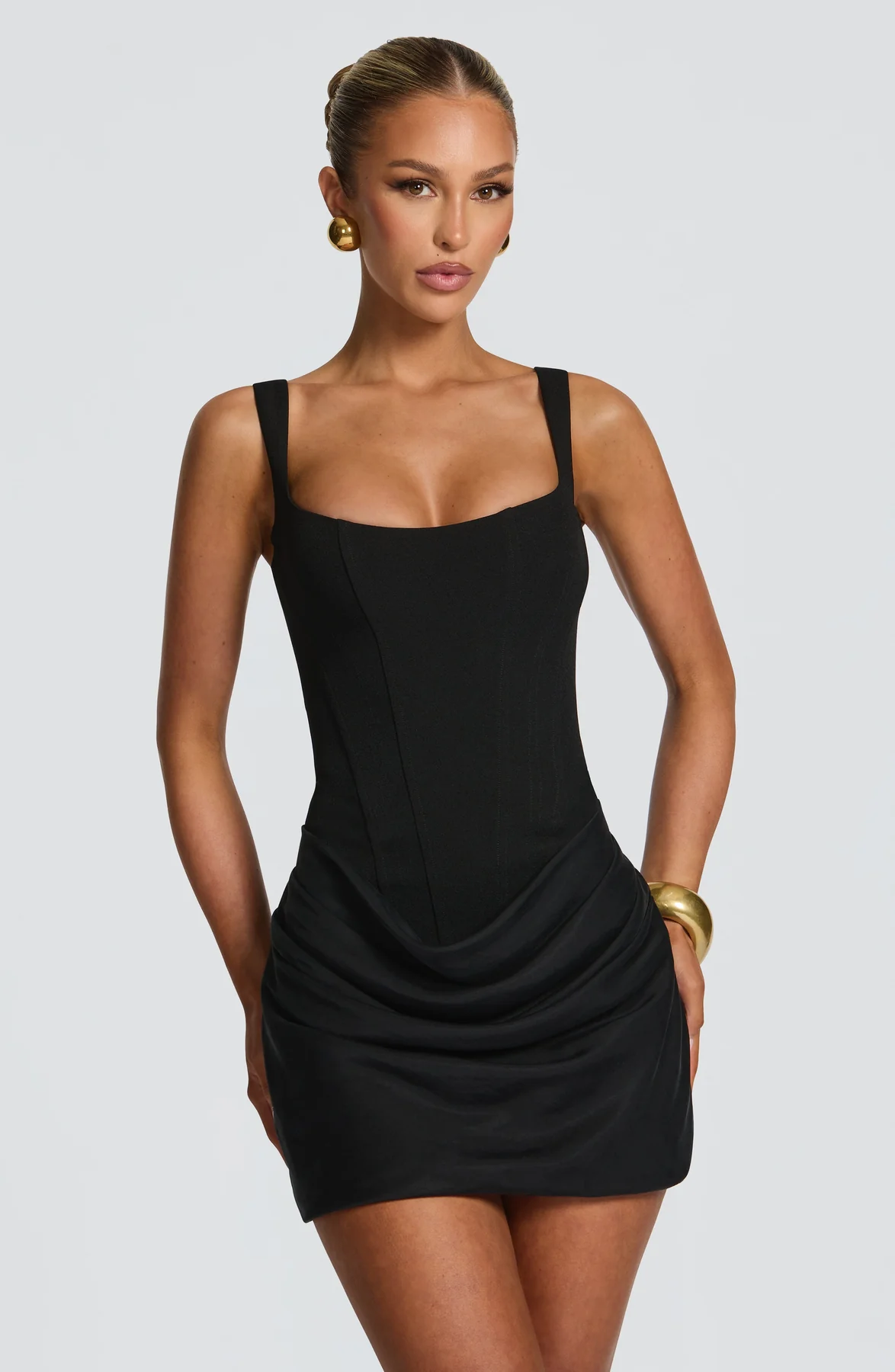 Women's mini dress with square neckline, draped skirt and lace-up back