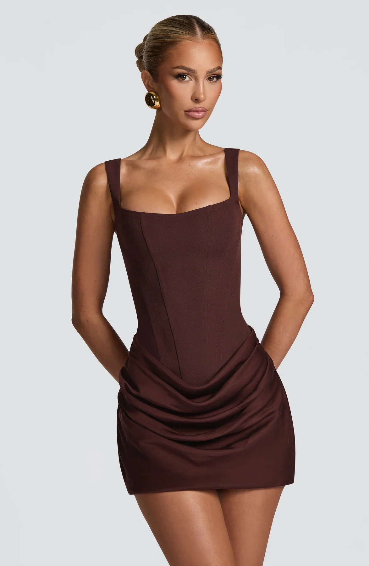 Women's mini dress with square neckline, draped skirt and lace-up back