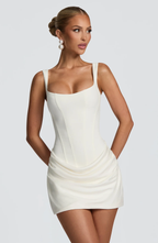Women's mini dress with square neckline, draped skirt and lace-up back
