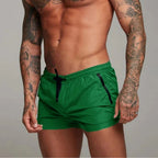 Men's swim shorts with zip pockets and drawstring waist, available in multiple colours