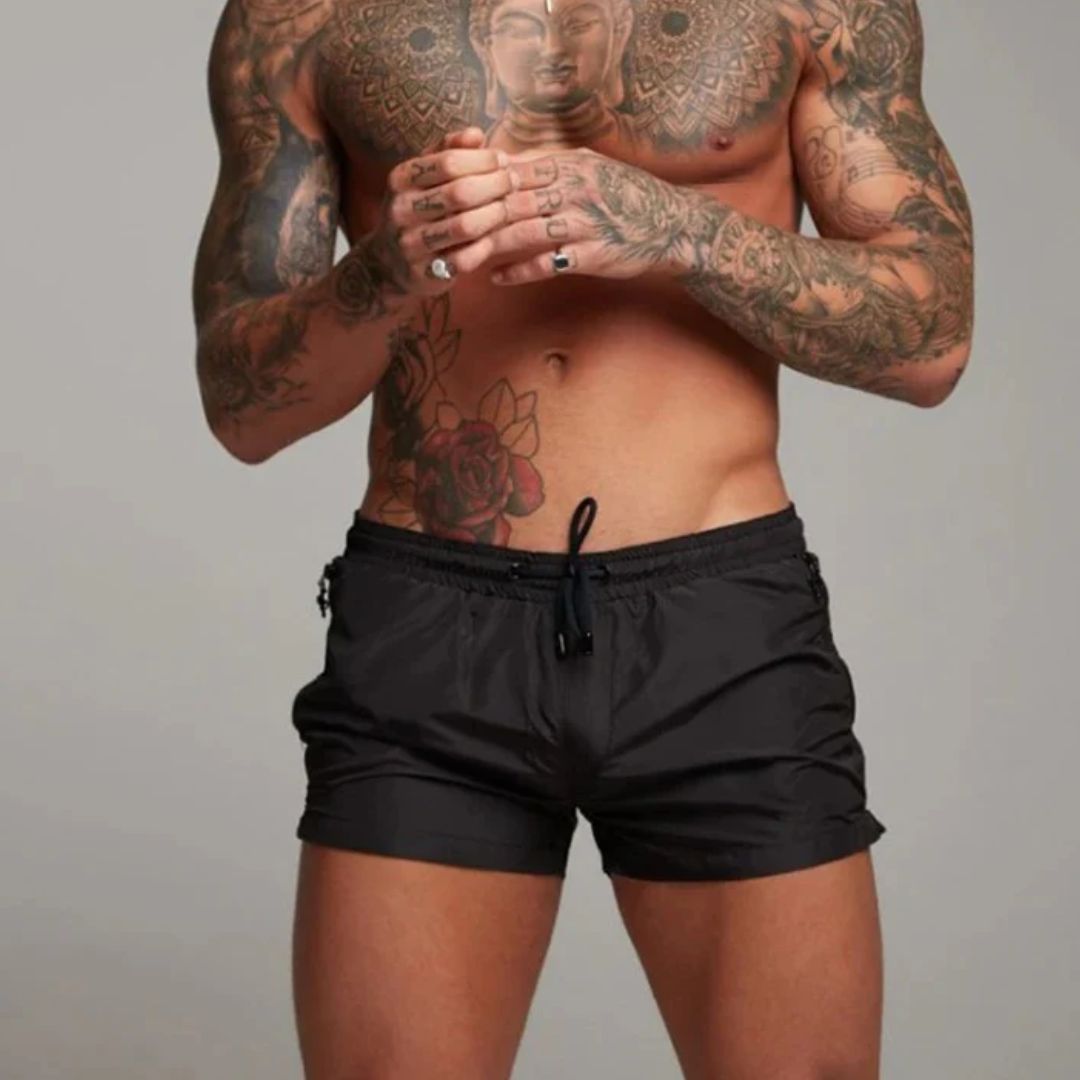 Men's swim shorts with zip pockets and drawstring waist, available in multiple colours