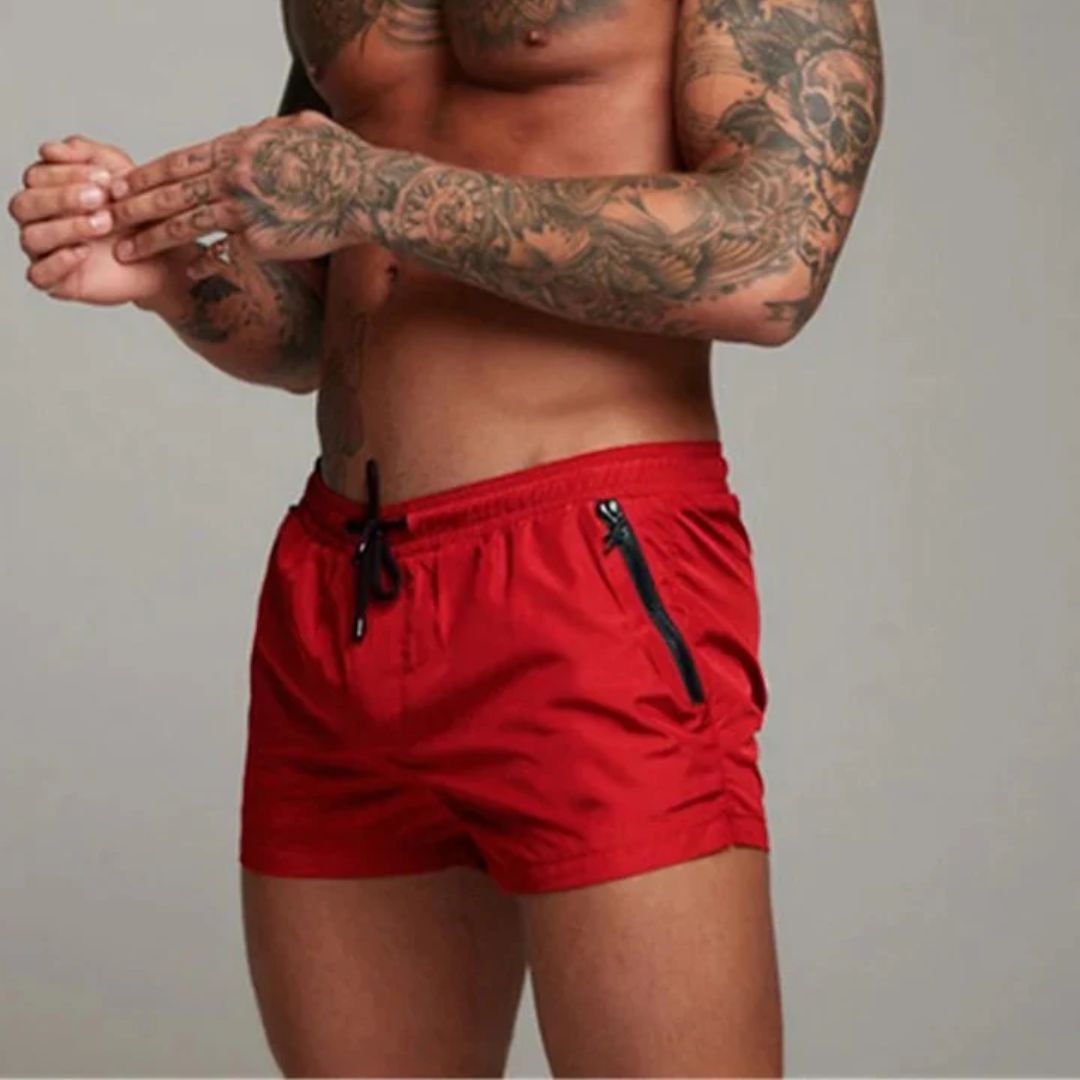 Men's swim shorts with zip pockets and drawstring waist, available in multiple colours