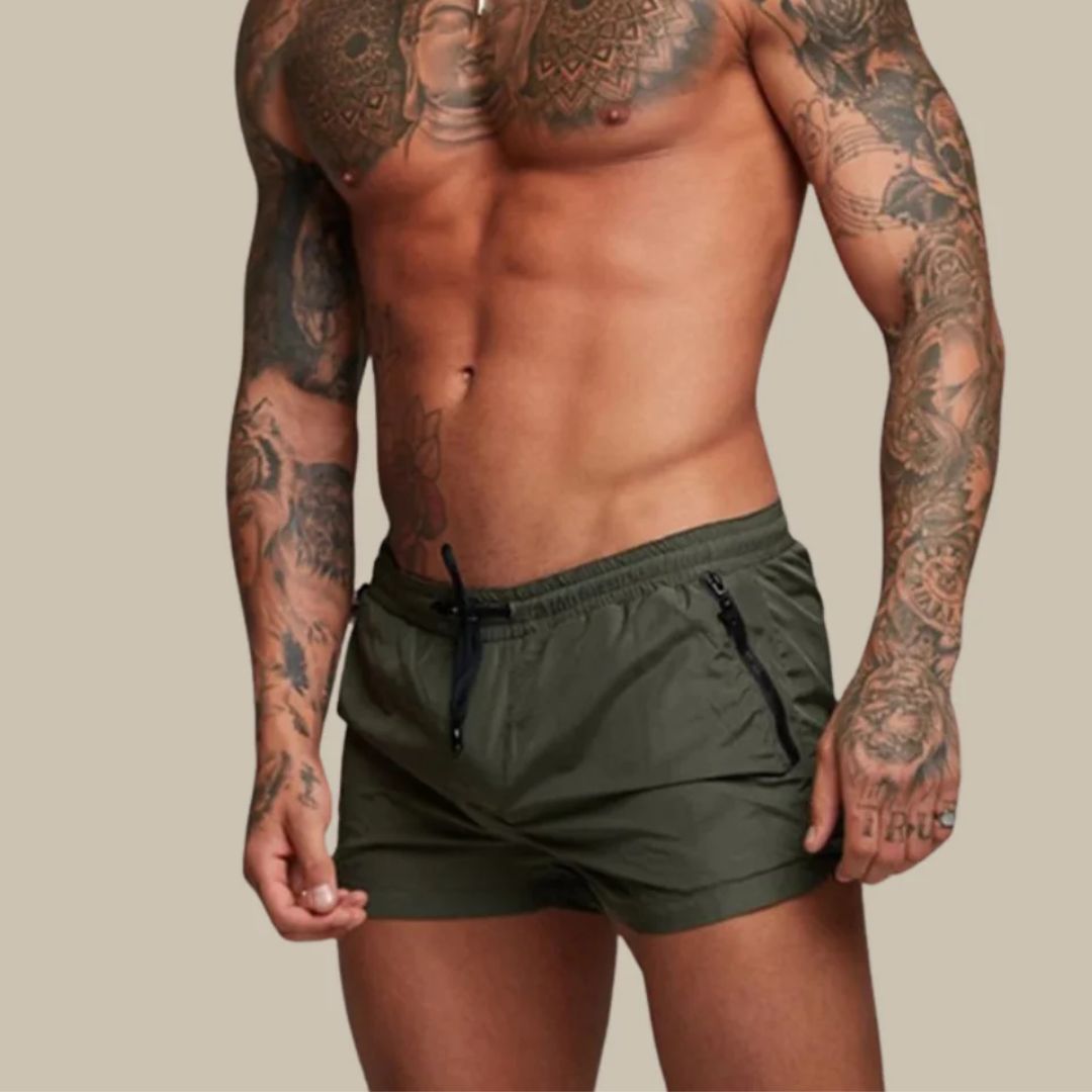 Men's swim shorts with zip pockets and drawstring waist, available in multiple colours