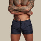 Men's swim shorts with zip pockets and drawstring waist, available in multiple colours