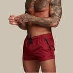 Men's swim shorts with zip pockets and drawstring waist, available in multiple colours