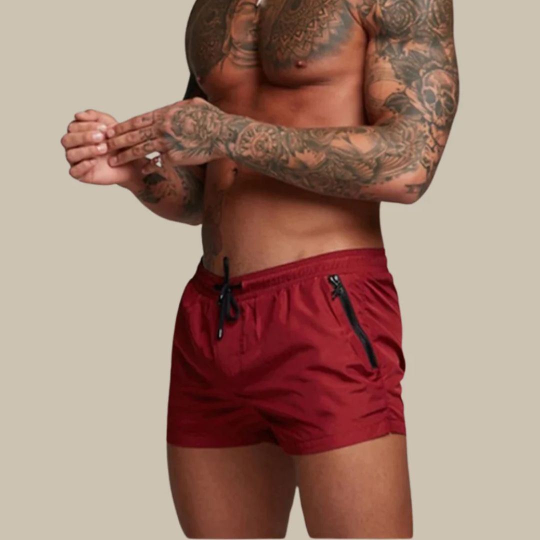 Men's swim shorts with zip pockets and drawstring waist, available in multiple colours