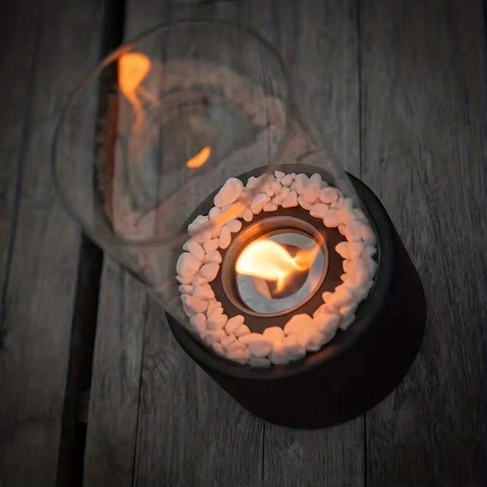 Decorative ethanol oil lamp with metal frame, glass cylinder, and decorative stones, indoor and outdoor