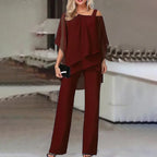 Women's two-piece set with off-shoulder top and fitted pants in vibrant colours
