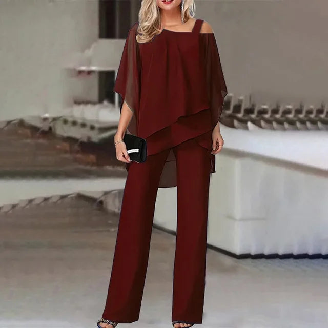 Women's two-piece set with off-shoulder top and fitted pants in vibrant colours