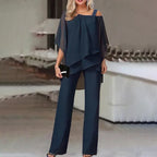 Women's two-piece set with off-shoulder top and fitted pants in vibrant colours