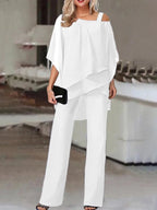 Women's two-piece set with off-shoulder top and fitted pants in vibrant colours