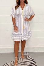 Women's boho midi dress with ethnic print, lace V-neckline and pompon sleeve details