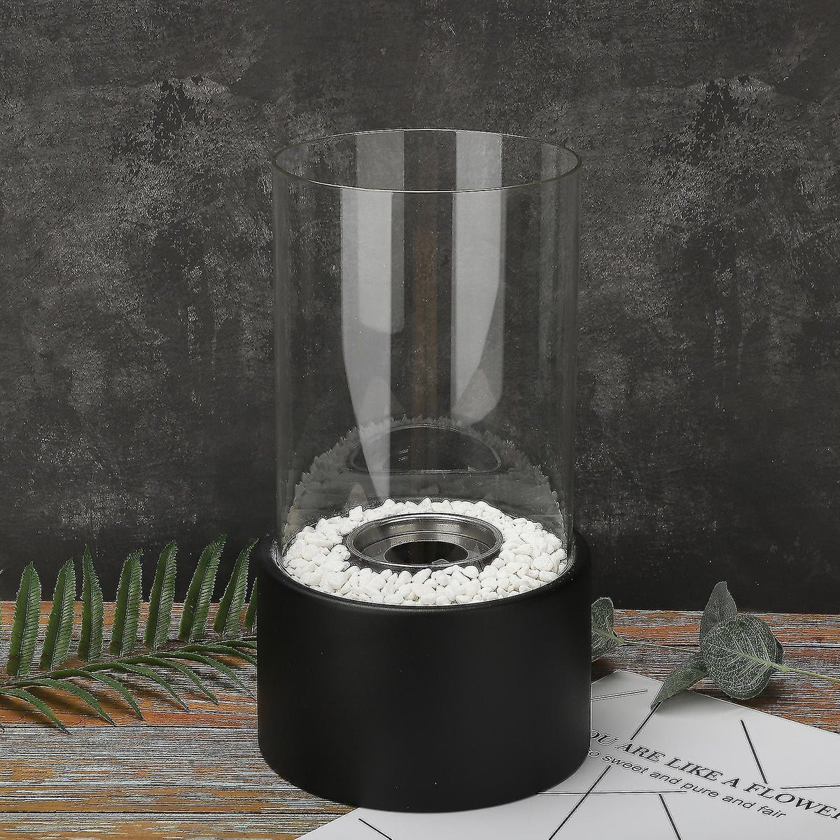 Decorative ethanol oil lamp with metal frame, glass cylinder, and decorative stones, indoor and outdoor