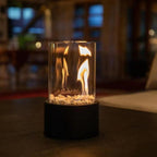 Decorative ethanol oil lamp with metal frame, glass cylinder, and decorative stones, indoor and outdoor