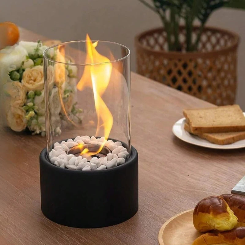 Decorative ethanol oil lamp with metal frame, glass cylinder, and decorative stones, indoor and outdoor