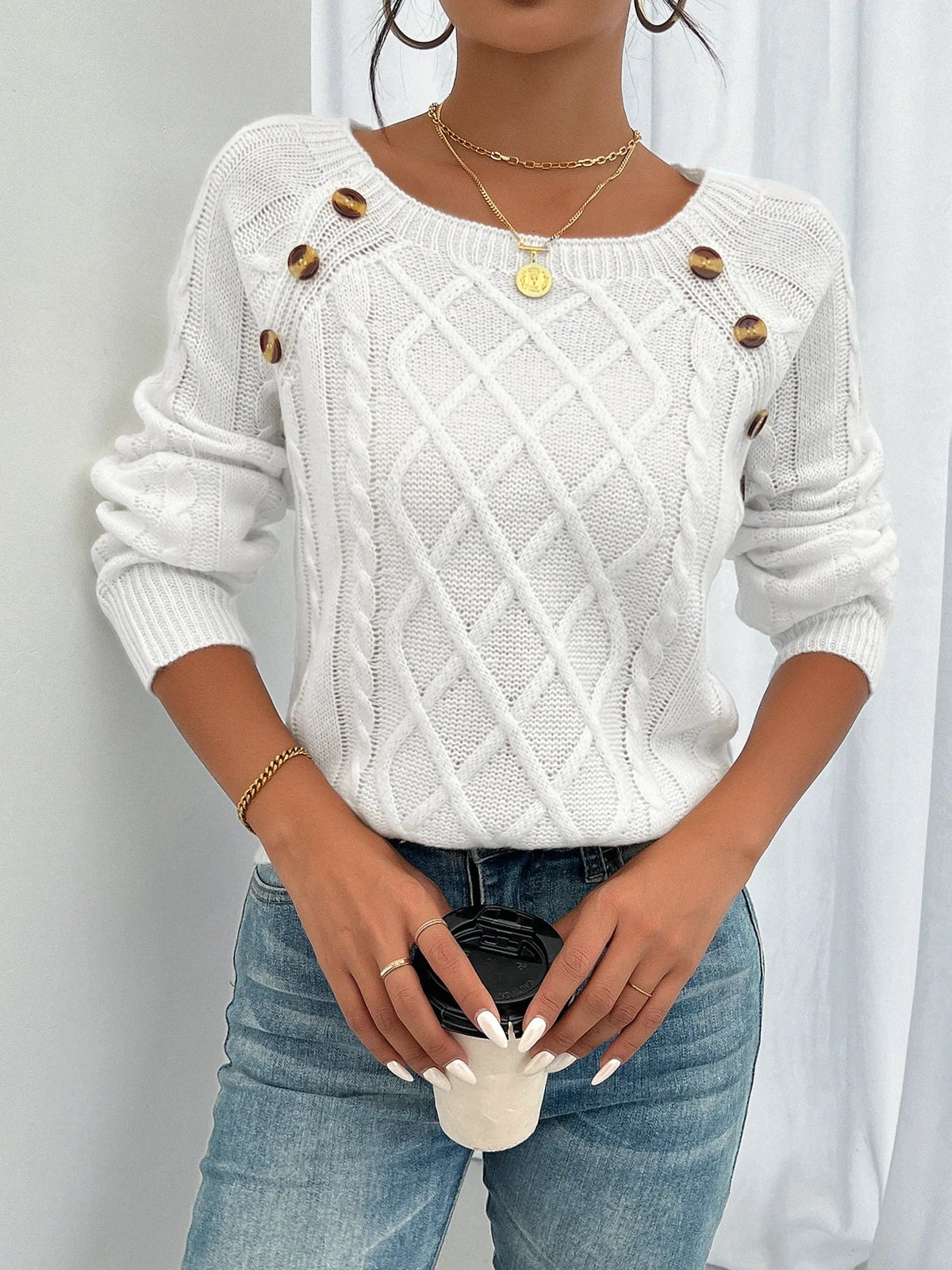 Women's winter cable knit pullover sweater with decorative button detail