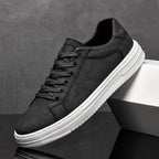Genuine leather sneakers with subtle textured design and rubber outsole