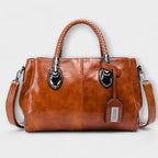 Women structured handbag in a balanced silhouette available in Black Blue Red and Brown