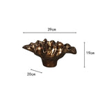 Decorative bronze resin bowl used as tabletop vase and sculptural centerpiece