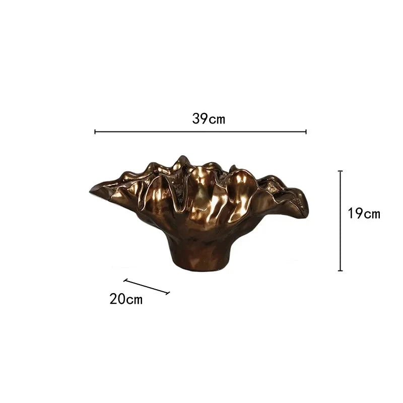 Decorative bronze resin bowl used as tabletop vase and sculptural centerpiece