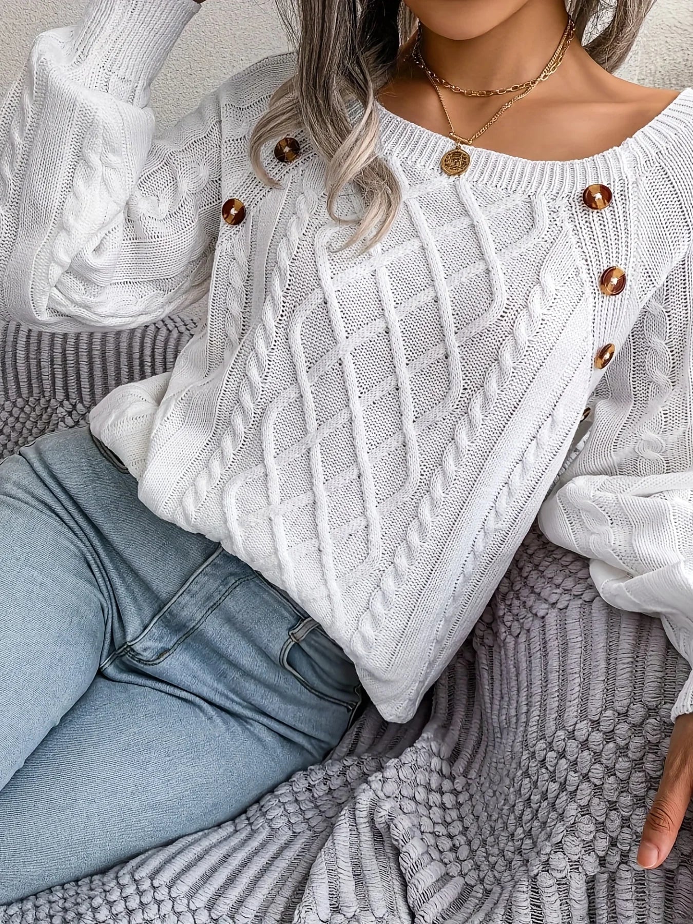 Women's winter cable knit pullover sweater with decorative button detail