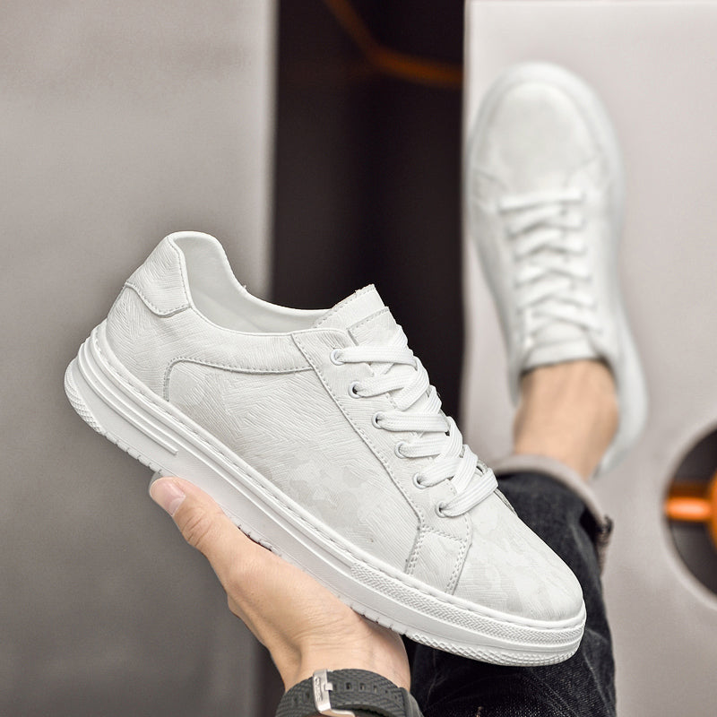 Genuine leather sneakers with subtle textured design and rubber outsole
