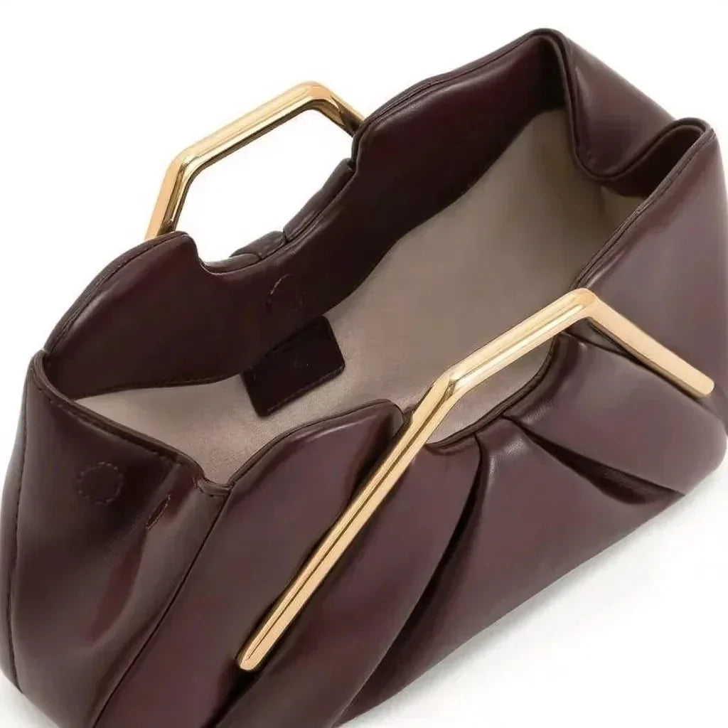 Clutch bag with origami folds and polished gold hexagonal handle in microfiber leather