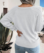 Women's winter cable knit pullover sweater with decorative button detail
