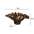 Decorative bronze resin bowl used as tabletop vase and sculptural centerpiece