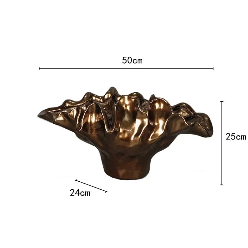 Decorative bronze resin bowl used as tabletop vase and sculptural centerpiece