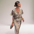 Women's pink flowy maxi dress with twisted V-neckline, elegant special occasion style