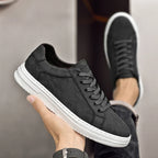 Genuine leather sneakers with subtle textured design and rubber outsole
