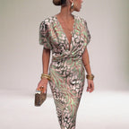 Women's pink flowy maxi dress with twisted V-neckline, elegant special occasion style
