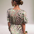 Women's pink flowy maxi dress with twisted V-neckline, elegant special occasion style