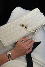 Women vegan leather baguette clutch bag with gold knot hardware and crossbody strap