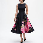 Black midi cocktail dress with floral print A-line skirt and sleeveless bateau neckline
