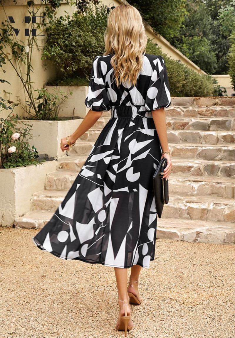 Floral midi dress with puff sleeves and flattering waist-tailored fit