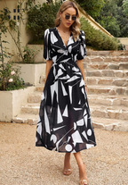 Floral midi dress with puff sleeves and flattering waist-tailored fit