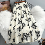 Women's A-line skirt with vibrant floral print, available in multiple colors