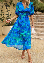 Floral midi dress with puff sleeves and flattering waist-tailored fit