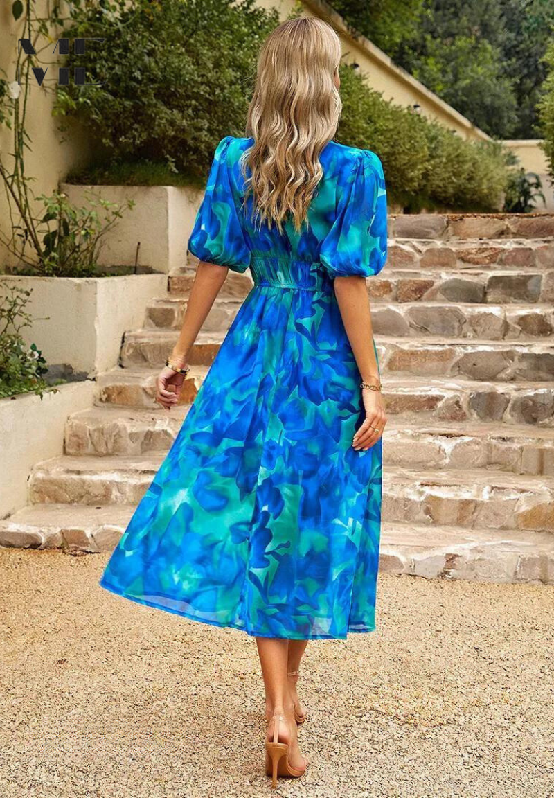 Floral midi dress with puff sleeves and flattering waist-tailored fit