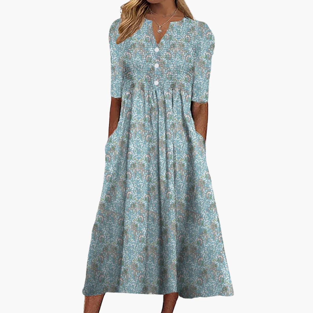 Women's blue floral midi dress with V-neckline, buttoned front and side pockets