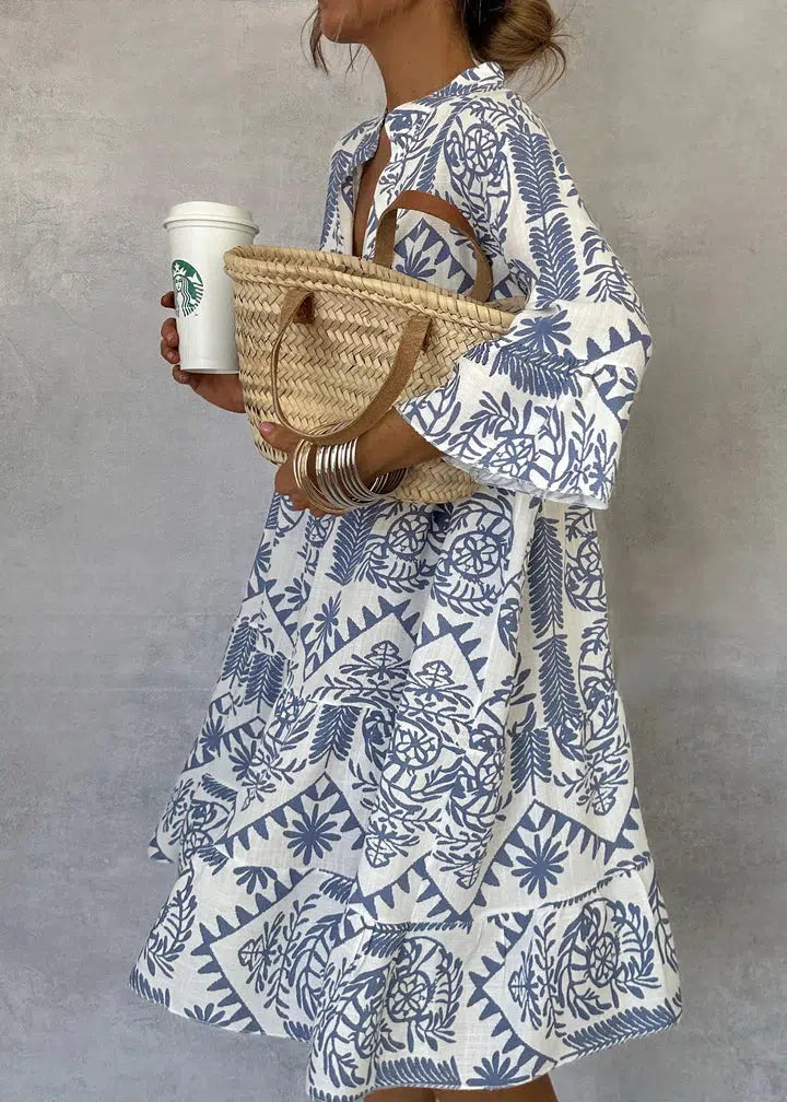 Women's white bohemian floral maxi dress with V-neckline, lightweight summer style