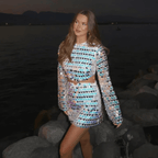 Women sequin mini dress with flared sleeves and waist cut-out detail