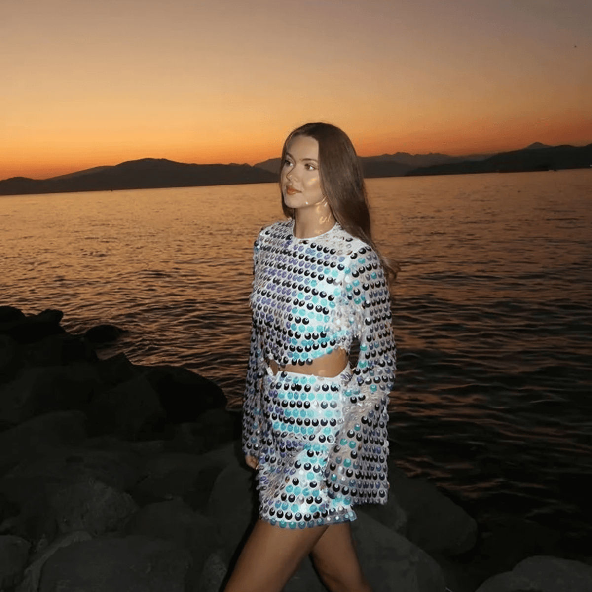 Women sequin mini dress with flared sleeves and waist cut-out detail